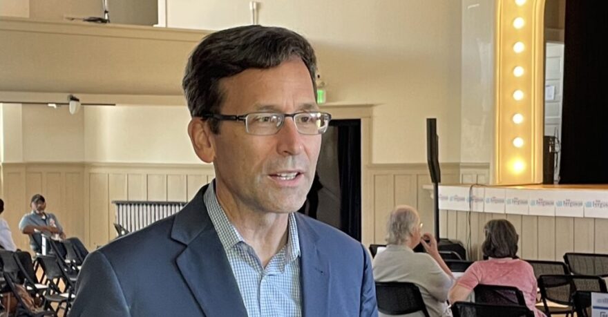 Attorney General Bob Ferguson speaks to a reporter as his 2024 gubernatorial campaign launch event gets underway in Seattle, Saturday, Sept. 9, 2023.