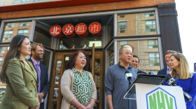 Million Asian Market owner Zhi Yong Wang speaks during a press conference outside his store. The New Haven Night Market starts Friday and will offer products and information about the Asian American population in New Haven.