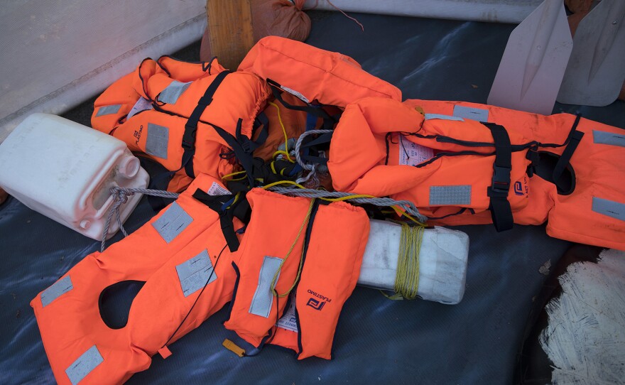 Life jackets are displayed in a pile at the Forced From Home exhibit on Tuesday, October 3, 2017, at the South Lake Union Discovery Center in Seattle. 