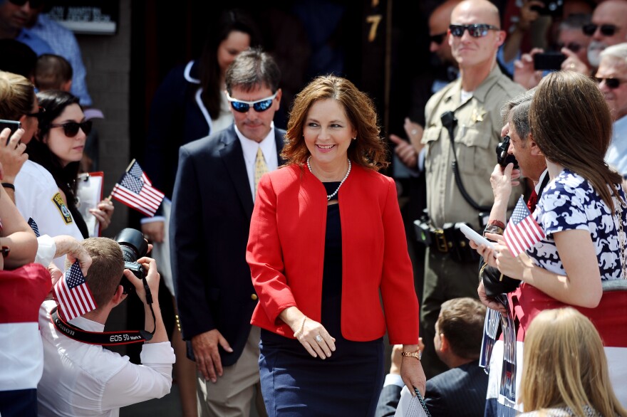 Darline Graham, sister of Sen. Lindsey Graham, R-S.C., walks to the stage before his announcement for presidency on Monday, June 1, 2015, in Central, S.C. (AP Photo/Rainier Ehrhardt)