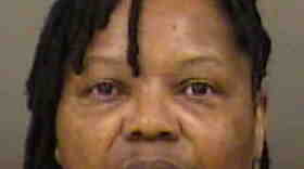 CMPD says Elvira Thomas tried to get a stolen gun through a security checkpoint at Charlotte Douglas International Airport. 