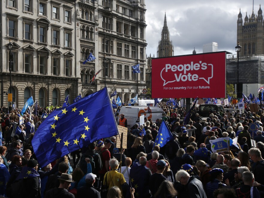 Demonstrators hold European Union flags and banners during a People's Vote march in London on Saturday.