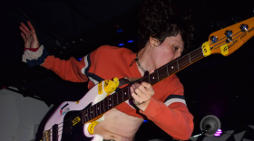 Iss Manzi, bassist and vocalist of Film and Gender, jumps as he plays bass at No Fun on Sept. 24, 2026