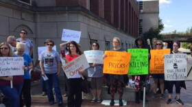 Protestors gathered outside the Eli Lilly headquarters in Indianapolis.
