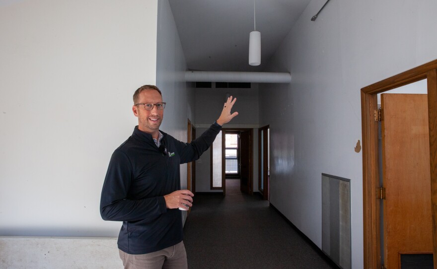 Supporters of a major overhaul of the Encounter building at 210 W. Mulberry St., Normal, meet for prayer and discussion