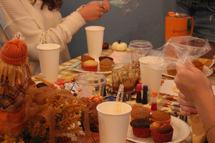 Decorating cupcakes in a fall theme was one of the activities guests took part in at the Coterie Market over the weekend. (Hailey Hoffmann/WUFT)