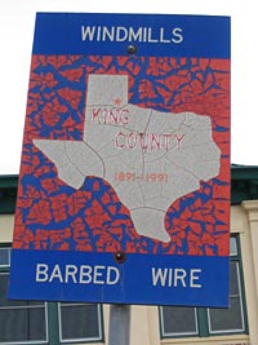 Windmills and barbed wire -- a sign outside the old King County Courthouse sums up the character of the land.