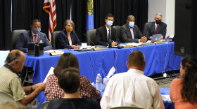 The Oklahoma Pardon and Parole Board, from left, Scott Williams, Kelly Doyle, Adam Luck, Larry Morris and Richard Smotherman, listen as the family of Paul Howell testifies at a commutation hearing for Julius Jones, in Oklahoma City on Sept. 13, 2021. Luck, the chairman of the Oklahoma Pardon and Parole Board who has consistently voted to spare the lives of death row inmates is resigning at the request of the governor.
