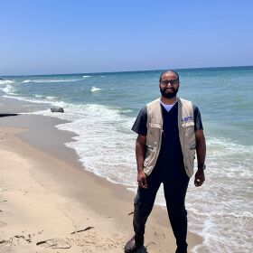Man on the Khan Younis beach at the edge of the Al-Mawasi refugee camp.