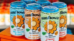 6 cans stand on an orange cabinent