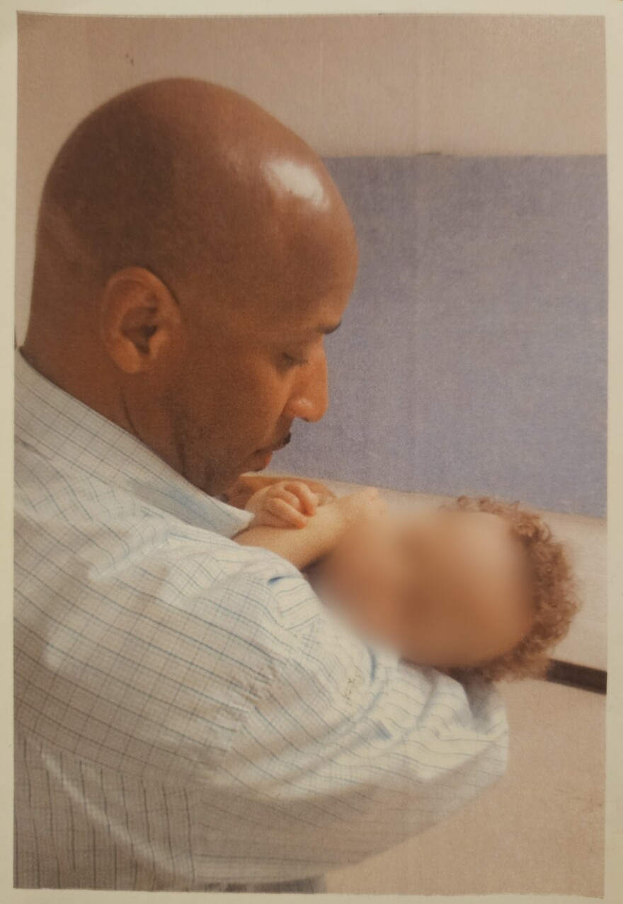 James Price holds his 1-year-old son for the first time at the Nebraska State Penitentiary on March 3, 2024.