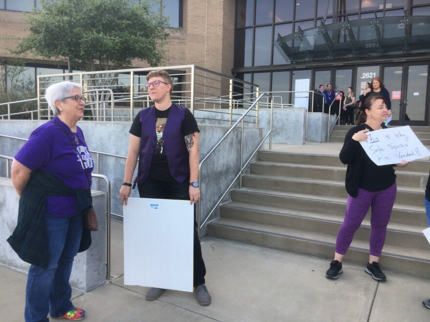 Supporters rally in support of former Irving Macarthur High School teacher Rachel Stonecipher. The English and journalism teacher was suspended last fall after putting up rainbow stickers and fired by the Irving School Baord earlier this week.