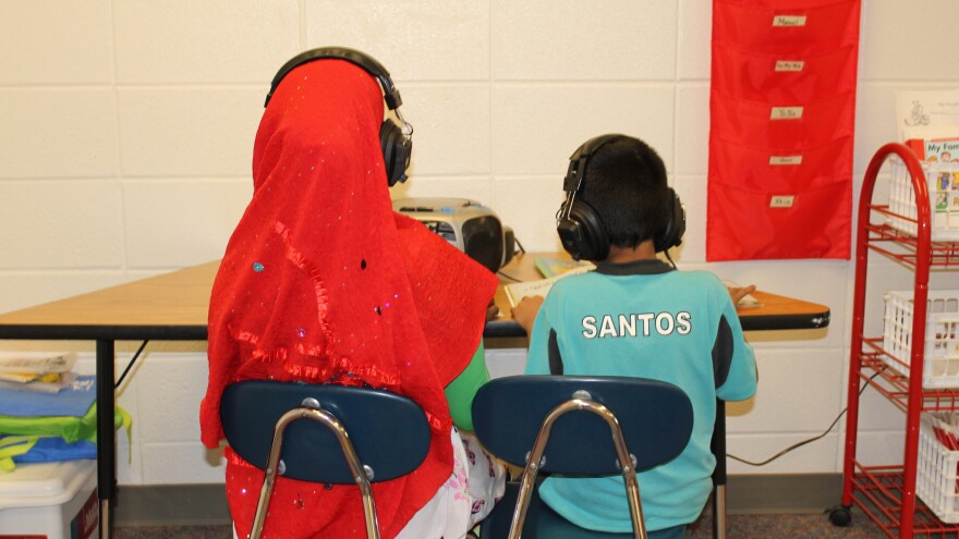 Two students in a "newcomer" class at Florence Wilson Elementary School in Garden City — a Somali girl (left), and a Hispanic boy.