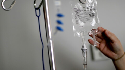 A nurse hooks up an IV to a flu patient at Upson Regional Medical Center in Thomaston, Ga., Feb. 9, 2018.