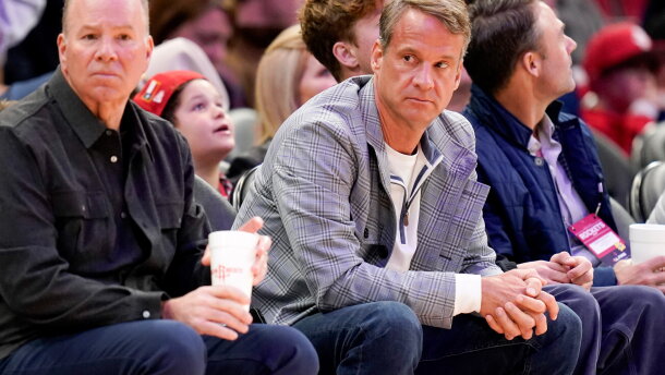 LSU football head coach Lane Kiffin, right, watches an NBA basketball game between the Houston Rockets and the Dallas Mavericks, Saturday, Jan. 31, 2026, in Houston. (AP Photo/Eric Christian Smith)