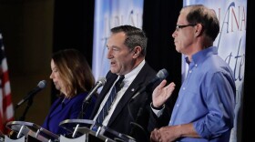 U.S. Sen. Joe Donnelly (D-Ind.), center, speaks during a U.S. Senate debate against Republican Mike Braun, right, and Libertarian Lucy Brenton, left. (Photo courtesy Indiana Debate Commission, Darron Cummings/AP)