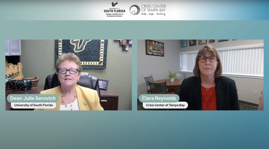  Two women dressed in business casual clothing sitting at desks while speaking virtually.