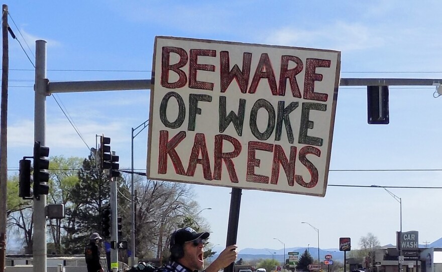 A lone counterprotester lines Main Street in Cortez during a “No Kings” rally that drew several hundred participants over the weekend, alongside a small number of counterprotesters.