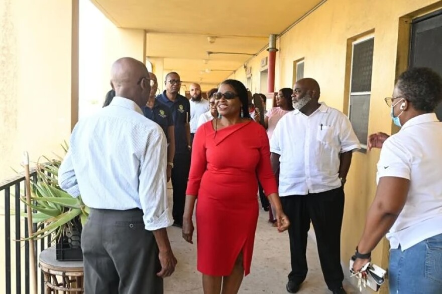 Commissioner Marleine Bastien touring housing in her district.