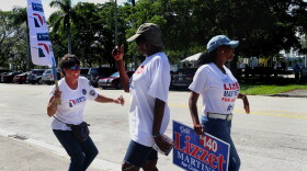 Lourdes Pons (left to right), Alease Dix and Mory Pedroso dance in front of the South Dade Regional Library on Sunday, August 26, during "Souls to the Polls."