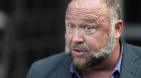 FILE - Right-wing conspiracy theorist Alex Jones speaks to the media after arriving at the federal courthouse for a hearing in front of a bankruptcy judge Friday, June 14, 2024, in Houston. (AP Photo/David J. Phillip, File)