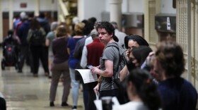 Voters wait in line to make a corrections to their ballots for the midterm elections at City Hall in Philadelphia, Monday, Nov. 7, 2022.