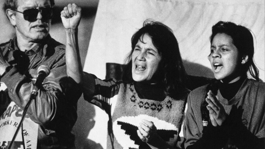United Farm Workers leader Dolores Huerta, center, leads a rally in San Francisco's Mission District on Nov. 19, 1988, along with Howard Wallace, president of the San Francisco chapter of the UFW, left, and Maria Elena Chavez, 16, the daughter of Cesar Chavez, right, as part of a national boycott of what the UFW claims is the dangerous use of pesticides on table grapes.