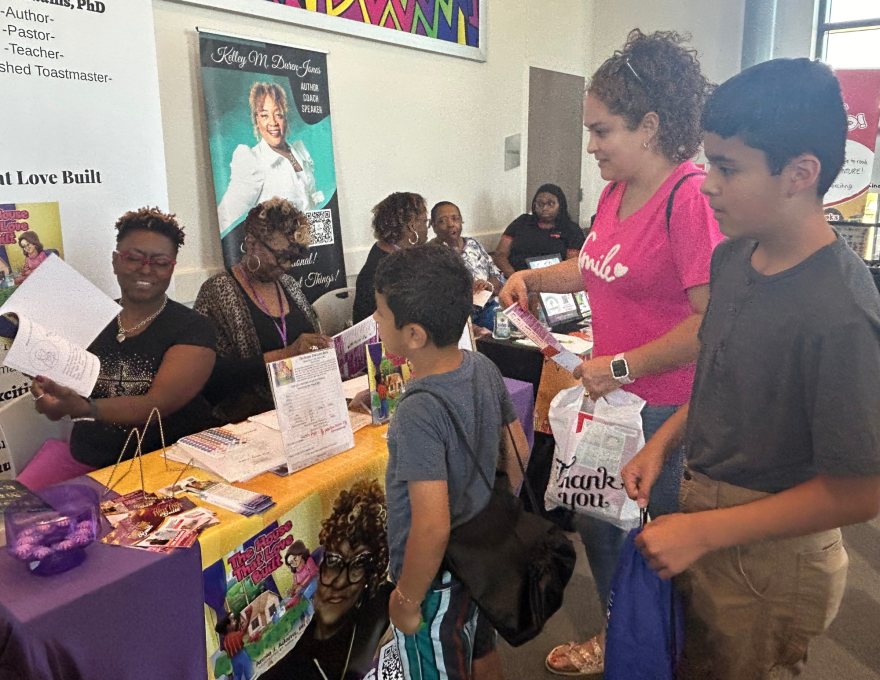 A family visiting the When I See Me Book Fair