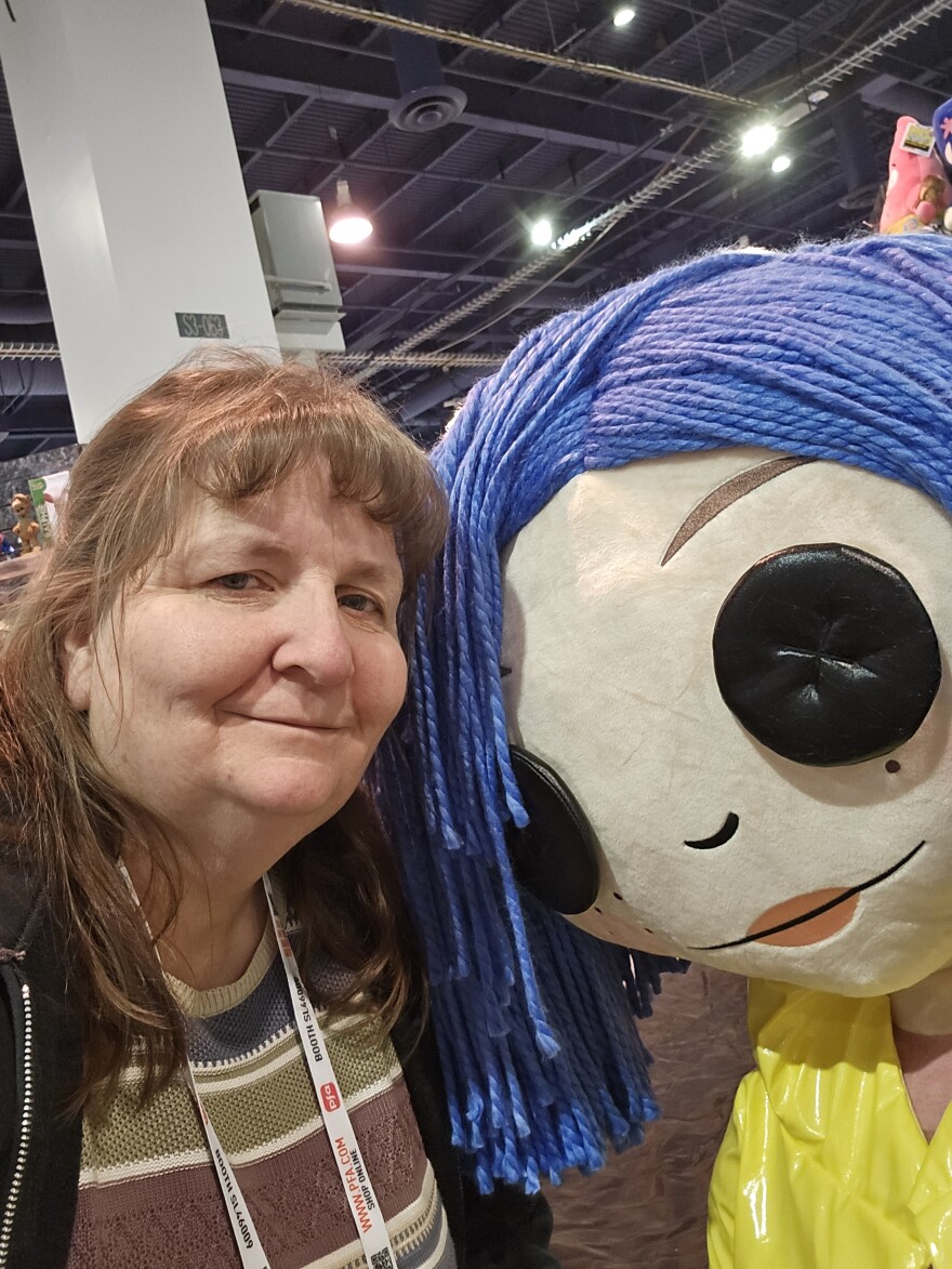 Woman with a life size Coraline
