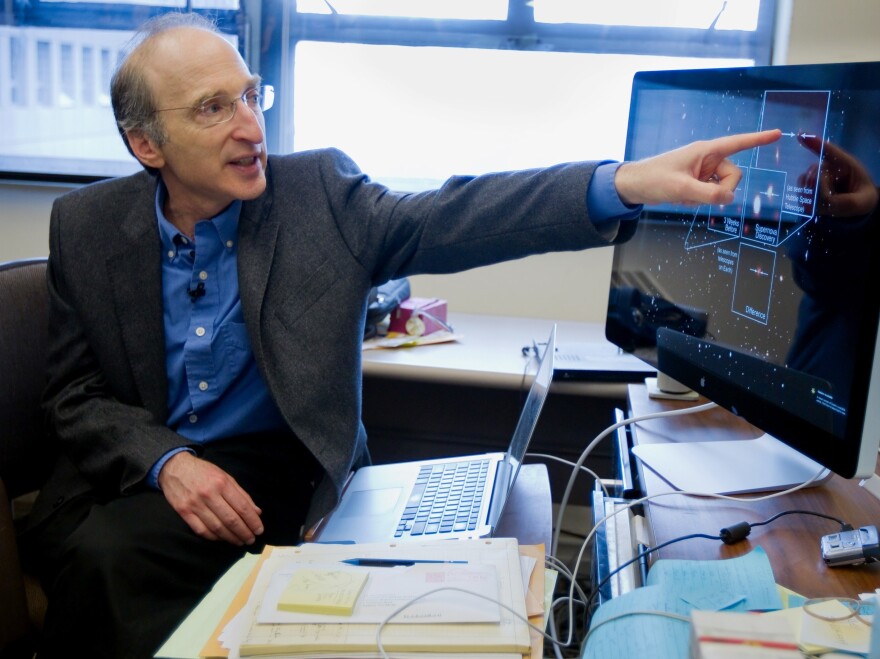 Nobel Prize winner Saul Perlmutter explains part of his research in astrophysics.