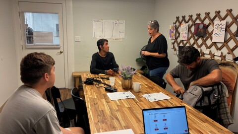Pastor Meg McBride leads an editorial meeting for the Homeless Herald.