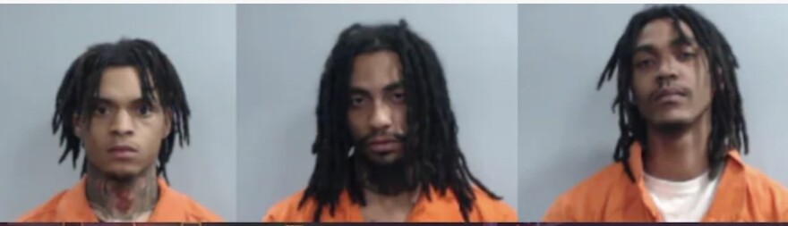 Side by side mug shots of three men