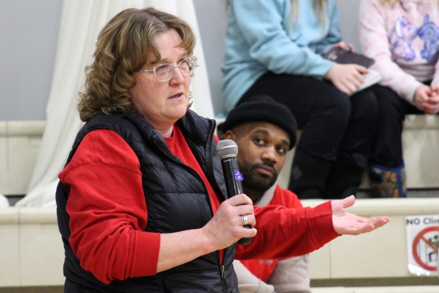 Sterling Elementary School teacher Tina Knutson asks questoins during a public meeting to address the proposed closure of her school due to budget cuts on Wednesday, Mar. 25, 2026 in Sterling, Alaska.
