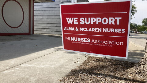 A "We support Alma nurses" sign sits in front of a house in Alma, Michigan.