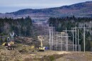 Heavy machinery is used to cut trees to widen an existing Central Maine Power power line corridor to make way for new utility poles, April 26, 2021, near Bingham, Maine.