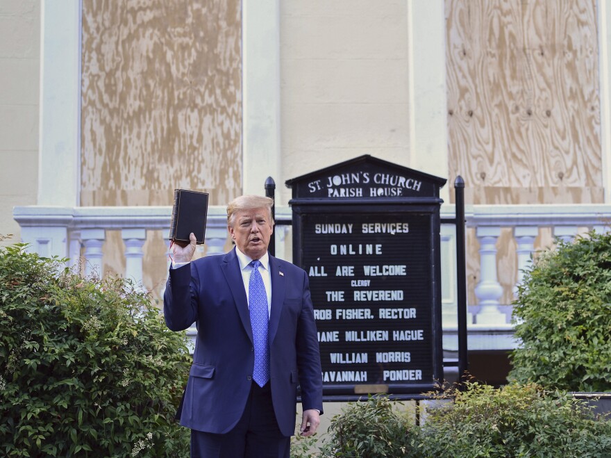 President Donald Trump holds up the Bible outside of St John's Episcopal church across Lafayette Park in Washington, D.C. on June 1, 2020.
