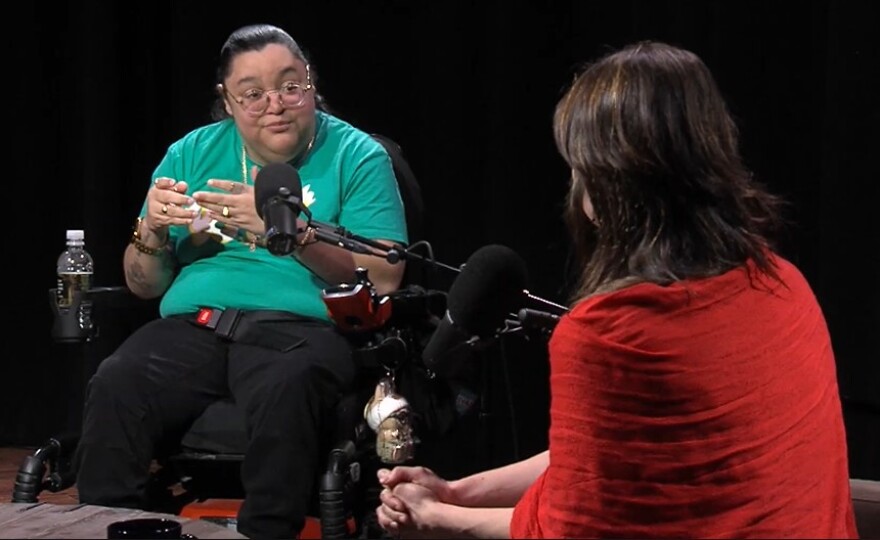 Jeiri Flores (left), an advocate based in Rochester, NY, speaks with WXXI News reporter Noelle Evans.