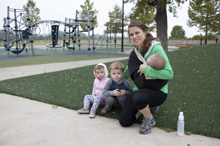 Tulsa resident Julianne Romanello with her children at the 41st Street Plaza, a popular city park along the Arkansas River.