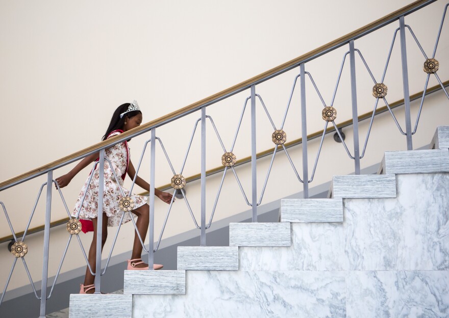 Tymia takes the stairs in the Rayburn House Office Building on her way to meet with Sanford. By the end of the day, she was using a wheelchair.