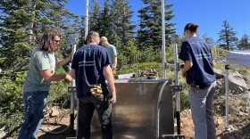 (From left to right) Dylan Whitney, Ben Aldridge, Hayden Peabody and Karlee Giuntoli inspect the power source panel for the seismic sensors.