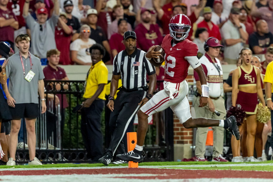 Alabama quarterback Keelon Russell (12) runs into the end zone for a 57-yard touchdown run against Florida State during the second half of an NCAA college football game Saturday, Sept. 19, 2026, in Tuscaloosa, Ala. (AP Photo/Vasha Hunt)