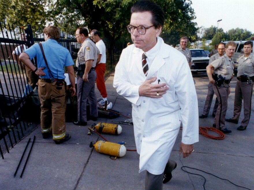 Tiller walks outside his clinic in Wichita after four people locked themselves to the entrance of the clinic's gates, in 1992.