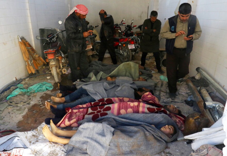 Bodies are wrapped in blankets after a suspected chemical attack in the town of Khan Shaykhun on Tuesday.