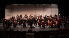 Music director James Allan Anderson with Sodelo on stage in 2026.