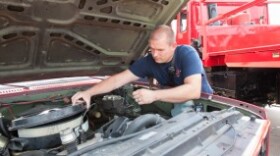 T.J. Coley, with the Choctaw Fire Department, checks the engine on a firetruck. The truck was a surplus from the Oklahoma Department of Agriculture, Food and Forestry.