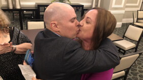 Lori Alhadeff kisses her husband, Ilan, after learning she won a seat on the Broward County school board.