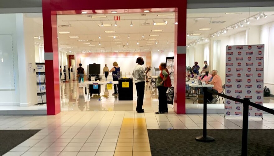 Voters cast their ballots for the November 2020 election at an early voting site inside Bloomington's Eastland Mall. A bill passed by the General Assembly will make additional voting options for Illinois voters permanent.