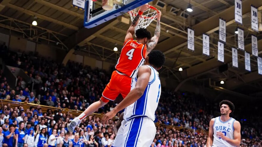 Guard Nate Kingz (4, Orange) dunks over Duke guard Caleb Foster (1, White).