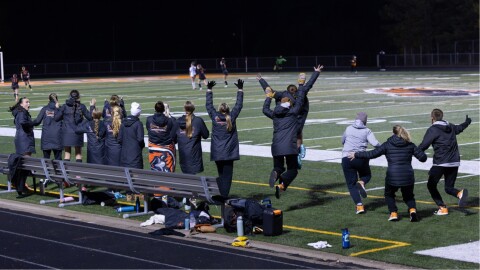 The Grand Rapids girls soccer team celebrates after scoring the game-winning goal in overtime on their home field on Oct. 14, 2025, to advance to the state tournament