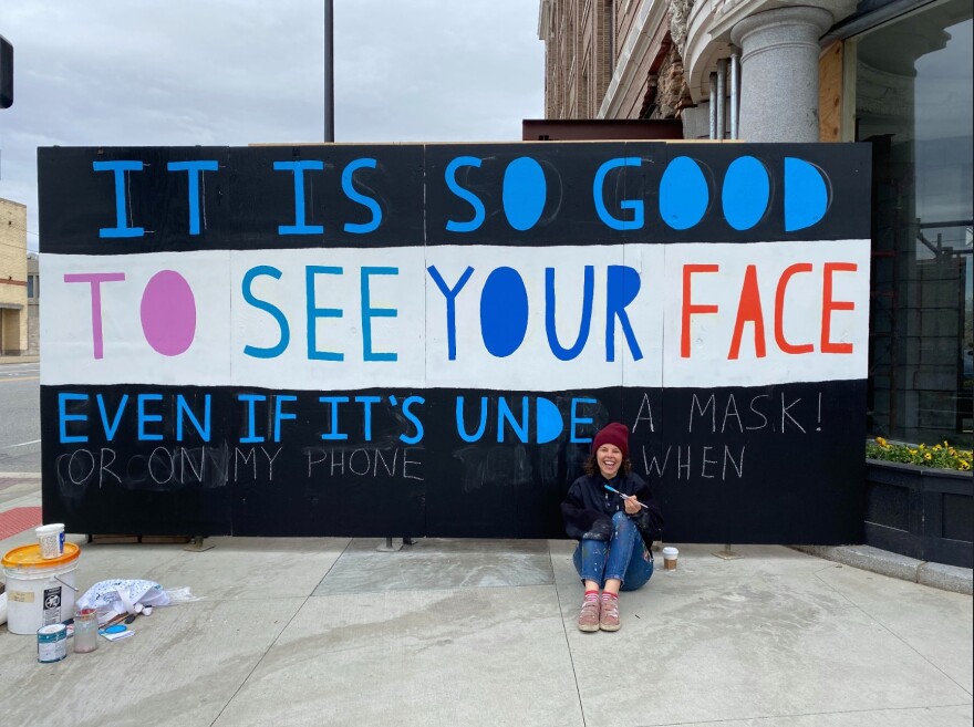 Artist Erin Guido seen painting one of two murals in Ohio City during April. [Erin Guido] 